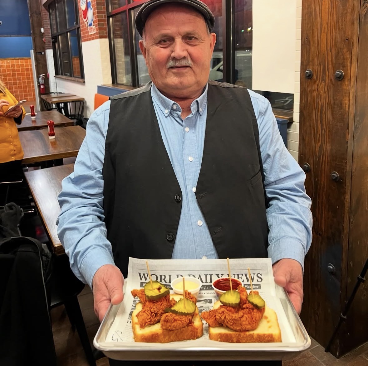 Baba proudly serving Babs hot chicken